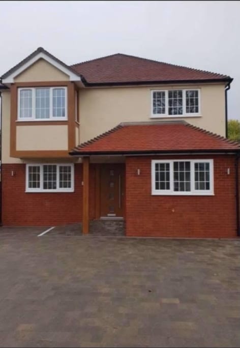 Rendered detached house with brick details in the Dover area, Kent
